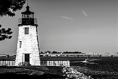 Lobsterboat Passes Newport Harbor Lighthouse BW